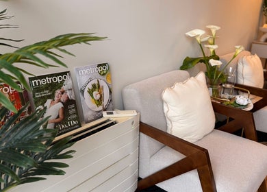 Comfortable waiting area at Rivera Spa and Massage, Christchurch, Canterbury Region, NZ with magazines and plants.