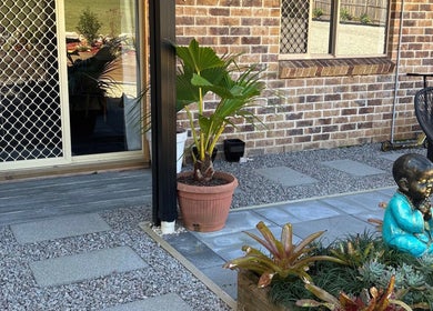 Tranquil garden view at Rosalie Skin Studio, Morayfield, Queensland, AU with plants and serene statue.