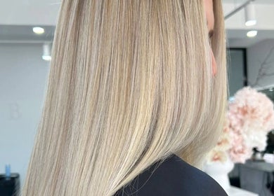 Silky blonde hair beautifully styled at Studio B Hair Salon in Melbourne, Victoria, AU showcasing premium service.