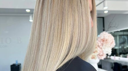 Silky blonde hair beautifully styled at Studio B Hair Salon in Melbourne, Victoria, AU showcasing premium service.
