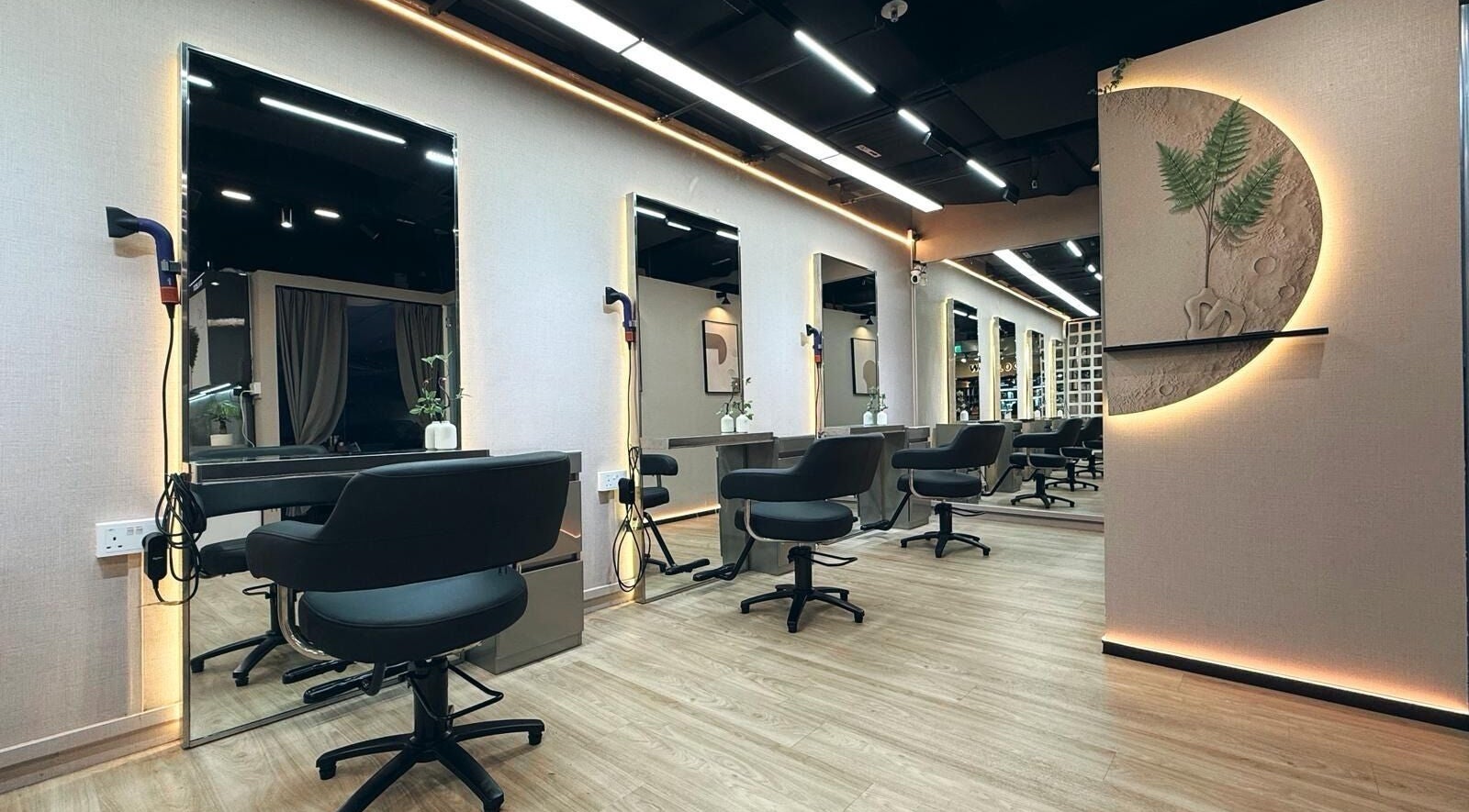 Modern interior of 7percent hair studio, Singapore, SG featuring sleek styling stations and ambient lighting.