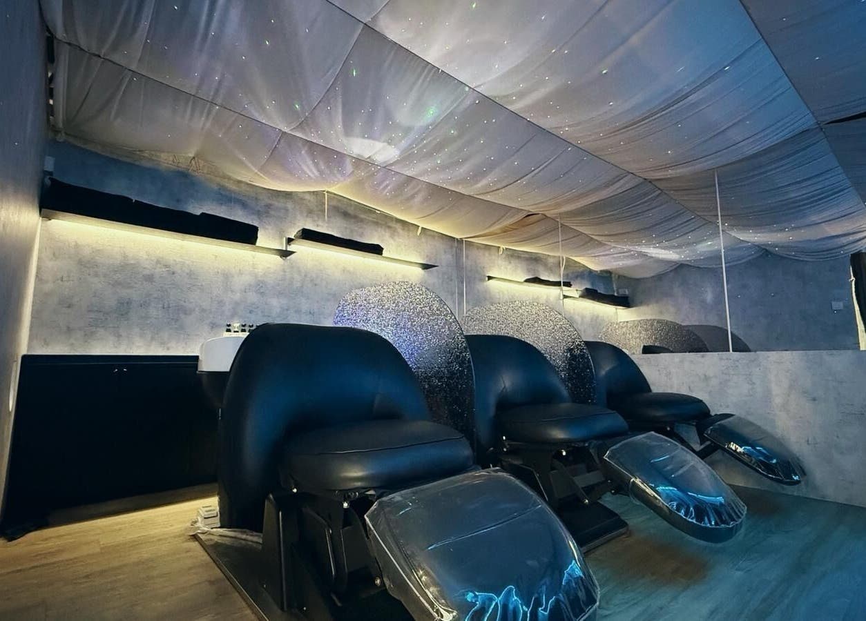 Elegant salon chairs under a star-like ceiling at 7percent hair studio, Singapore, Singapore, SG.