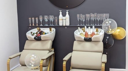 Elegant salon chairs with champagne at Love Your Hair in Totton, England, GB.