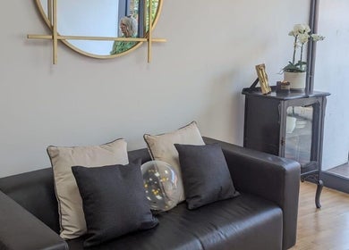 Elegant lounge with a sofa and decorative elements at Love Your Hair, Totton, England, GB.