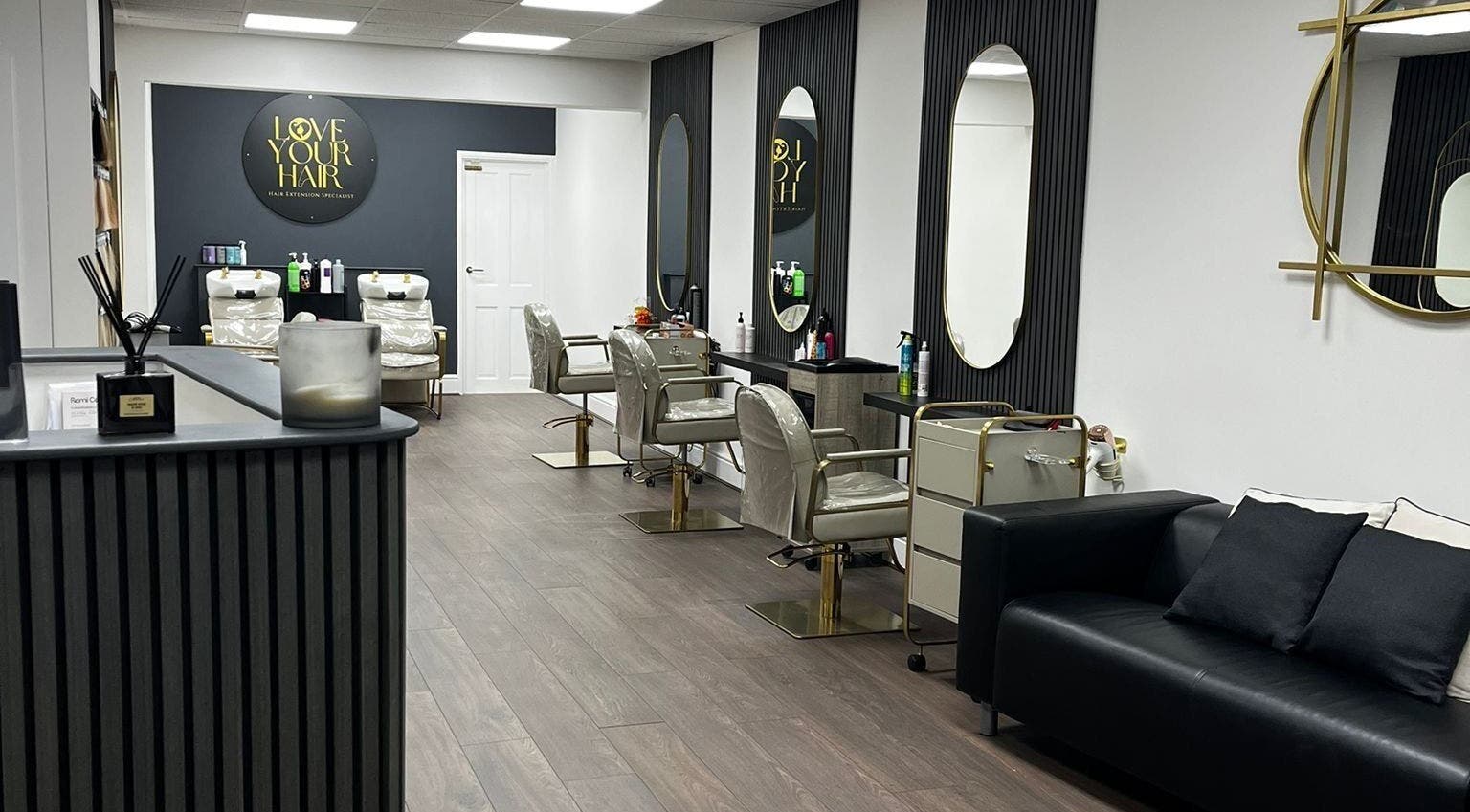 Elegant interior of Love Your Hair salon in Totton, England, GB, featuring styling chairs and modern decor.