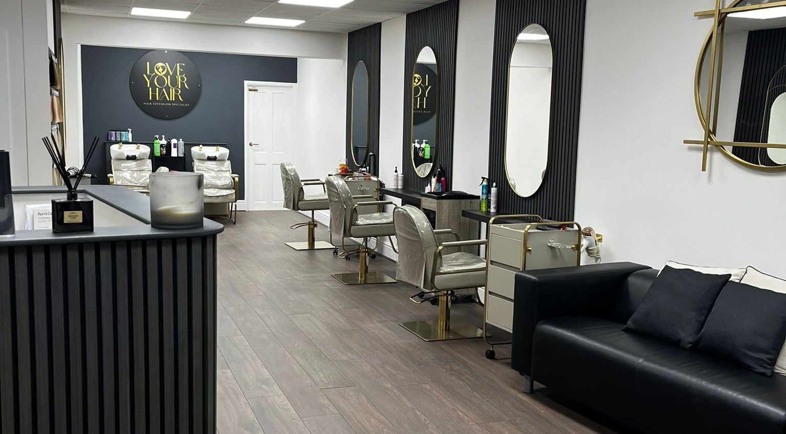 Elegant interior of Love Your Hair salon in Totton, England, GB, featuring styling chairs and modern decor.