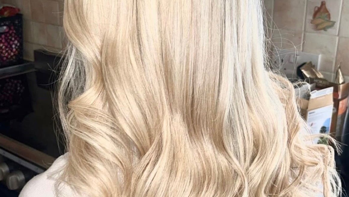 Blonde hair with flowing waves at K L Hair, Dunmurry, Northern Ireland, GB.