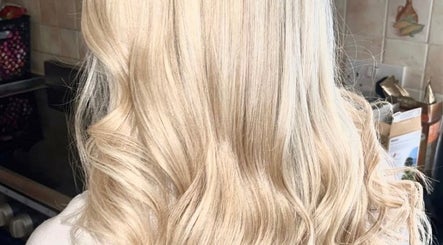 Blonde hair with flowing waves at K L Hair, Dunmurry, Northern Ireland, GB.