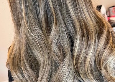 Blonde wavy hair styled at K L Hair, Dunmurry, Northern Ireland, GB. Elegant salon look.