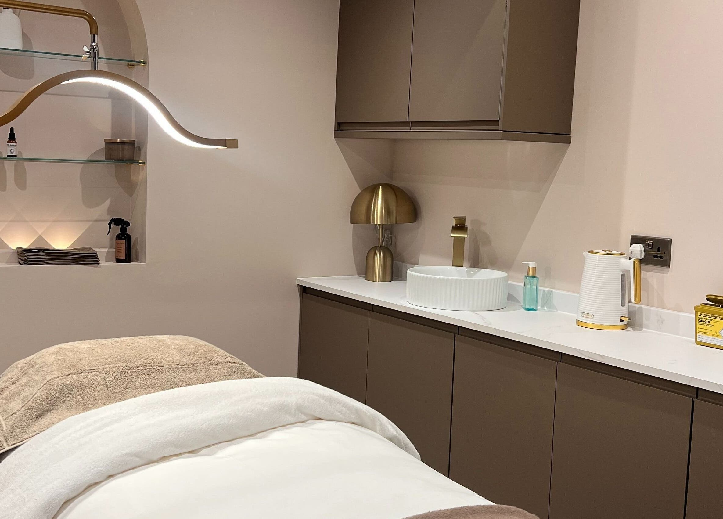 Relaxing treatment room at Illume Clinic, Woodhall Spa, England, GB with modern decor and soothing ambiance.