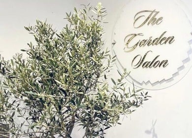 The Garden Salon logo beside lush greenery in Swindon, England, GB.