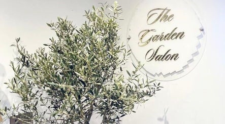 The Garden Salon logo beside lush greenery in Swindon, England, GB.