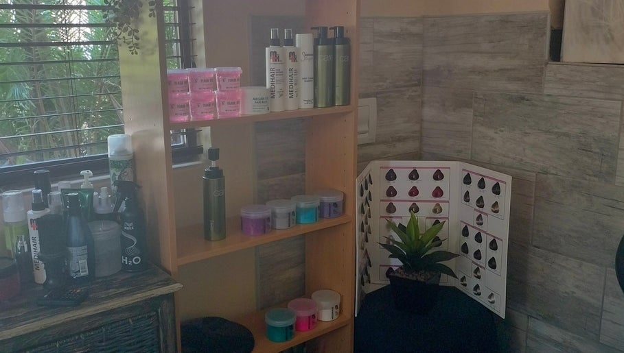 Haircare products on shelf at Areena Hair, East London, Eastern Cape, ZA enhance beauty experience.