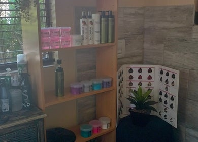 Haircare products on shelf at Areena Hair, East London, Eastern Cape, ZA enhance beauty experience.