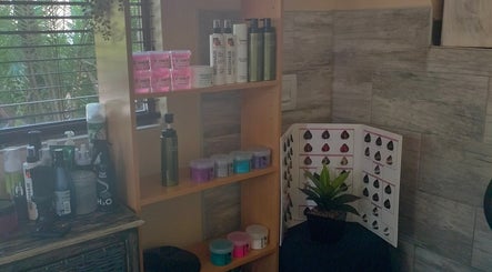 Haircare products on shelf at Areena Hair, East London, Eastern Cape, ZA enhance beauty experience.