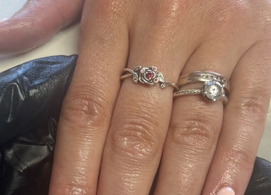 Beautifully manicured hand with rings at NailsbySa, Cardiff, Wales, GB.