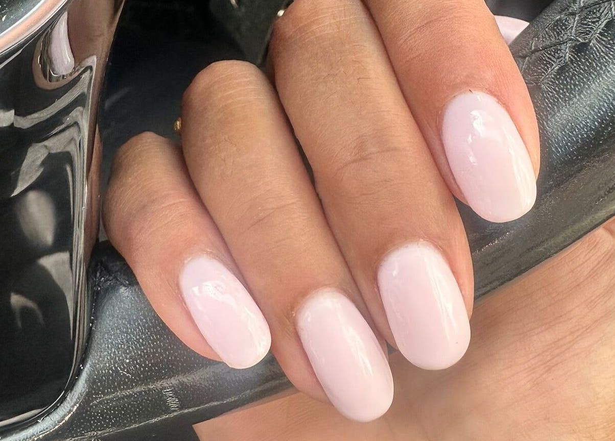 Elegant light pink manicure by NailsbySa in Cardiff, Wales, GB, showcasing glossy, well-shaped nails.