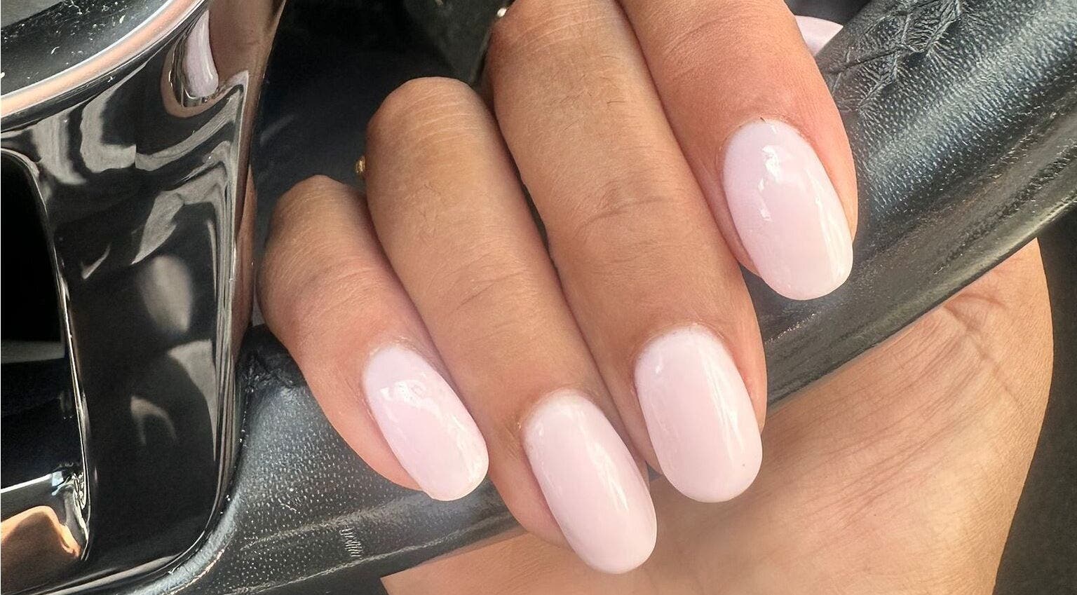 Elegant light pink manicure by NailsbySa in Cardiff, Wales, GB, showcasing glossy, well-shaped nails.