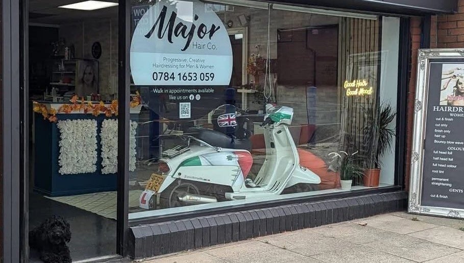 Front of Haus Of Leigh At Major Hair Co. in Leeds, England, GB, showcasing window display and a parked scooter.
