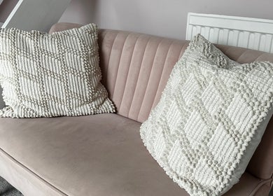 Chic pink sofa with textured cushions at Gel nails by Chloe, Pill, England, GB.