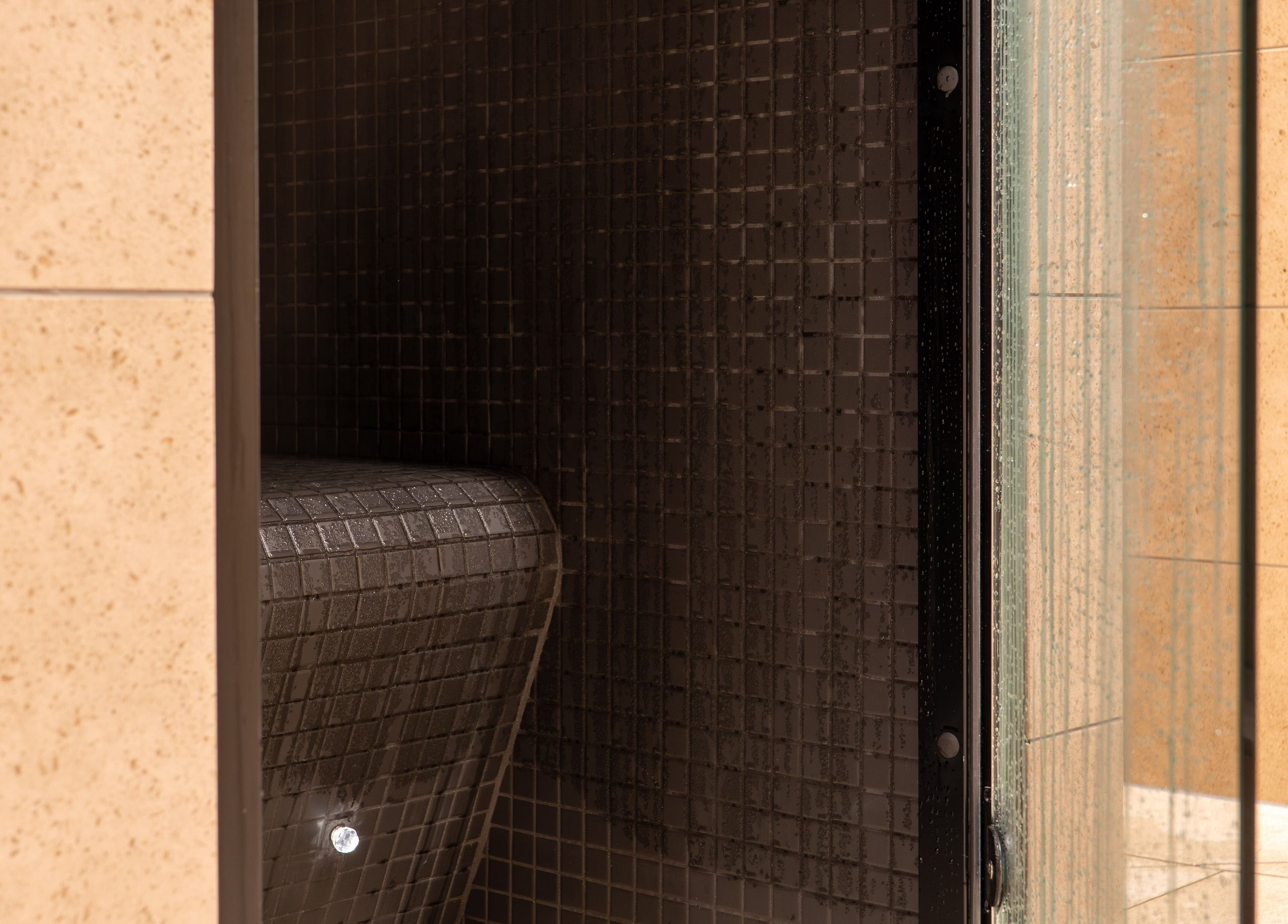 Luxurious steam room at Twr y Felin Hotel, St Davids, Wales, GB, with sleek tile design.