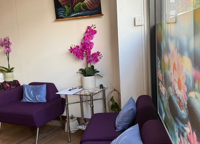 Relaxing seating area with orchids at Kenton Thai Massage Therapy Ltd., London, England, GB.