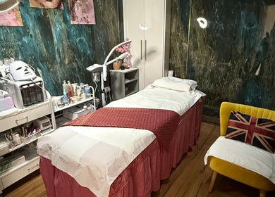 Relaxing massage room at Kenton Thai Massage Therapy Ltd., London, England, GB, featuring a cozy treatment bed.