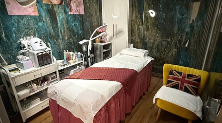 Relaxing massage room at Kenton Thai Massage Therapy Ltd., London, England, GB, featuring a cozy treatment bed.