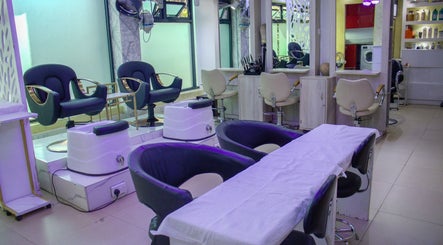 Modern salon interior at Strands On Fleek Hair & Nail Bar, Nairobi, Nairobi, KE, featuring styling chairs.