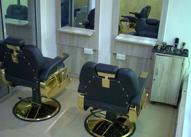 Luxurious chairs at Strands On Fleek Hair & Nail Bar, Nairobi, KE, showcasing elegance and comfort.
