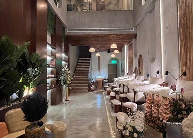 Modern, serene interior of Côte nail spa | كوت سبا in Riyadh, Riyadh Province, SA, featuring plush seats.