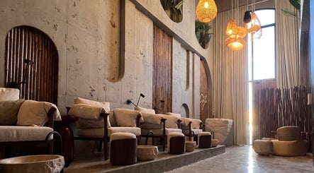 Relaxing interior of Côte nail spa | كوت سبا, Riyadh, Riyadh Province, SA with elegant seating and warm lighting.
