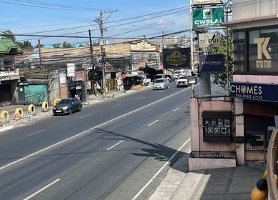 Street view near RoyalGem Salon and Spa, Tarlac City, Central Luzon, PH showcasing local businesses.