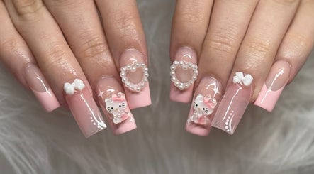 Elegant pink nail design with cute charms at Klawedbykat, Swaffham, England, GB.