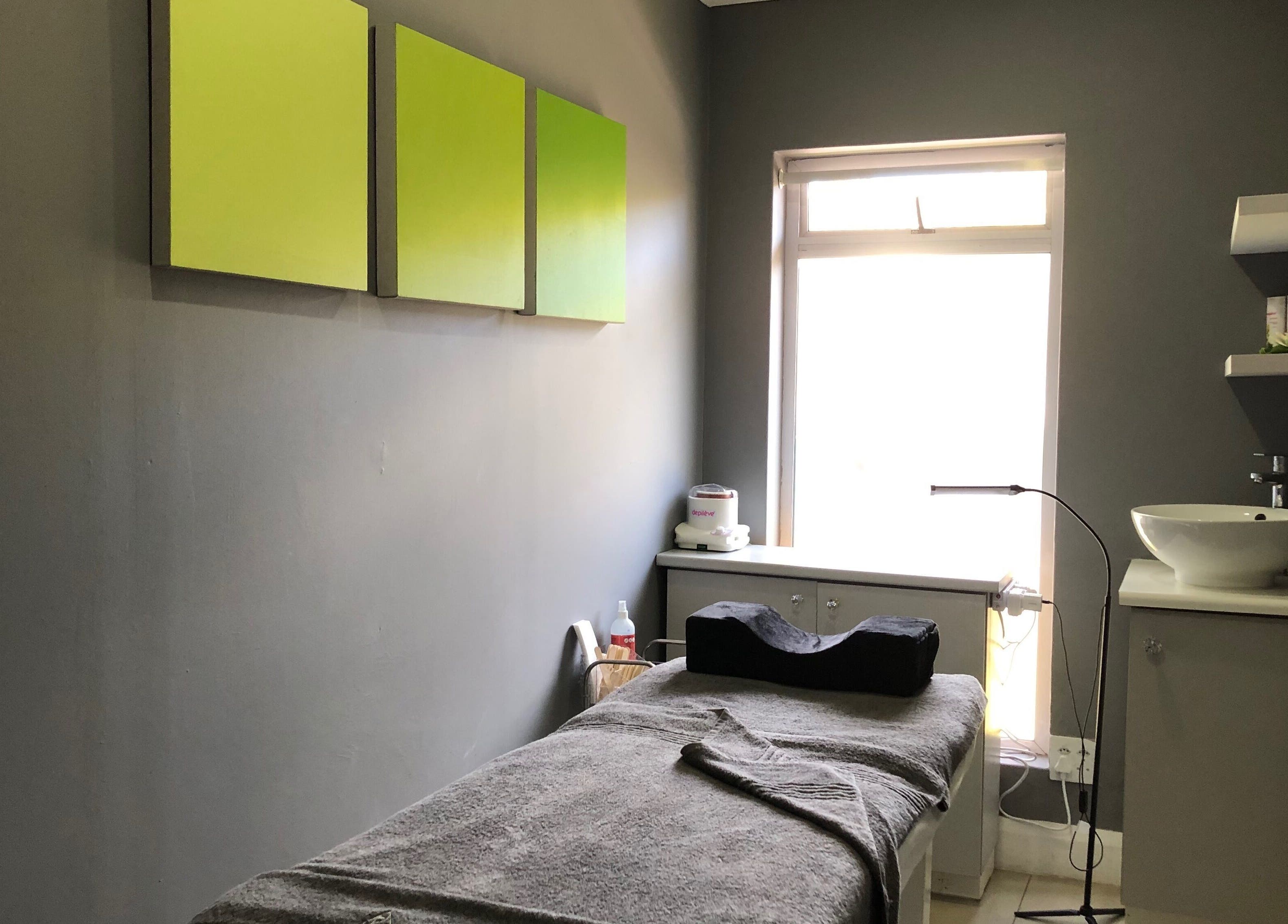 Relaxing treatment room at Brow Baby, Gqeberha, Eastern Cape, ZA, featuring soft lighting and cozy bed.