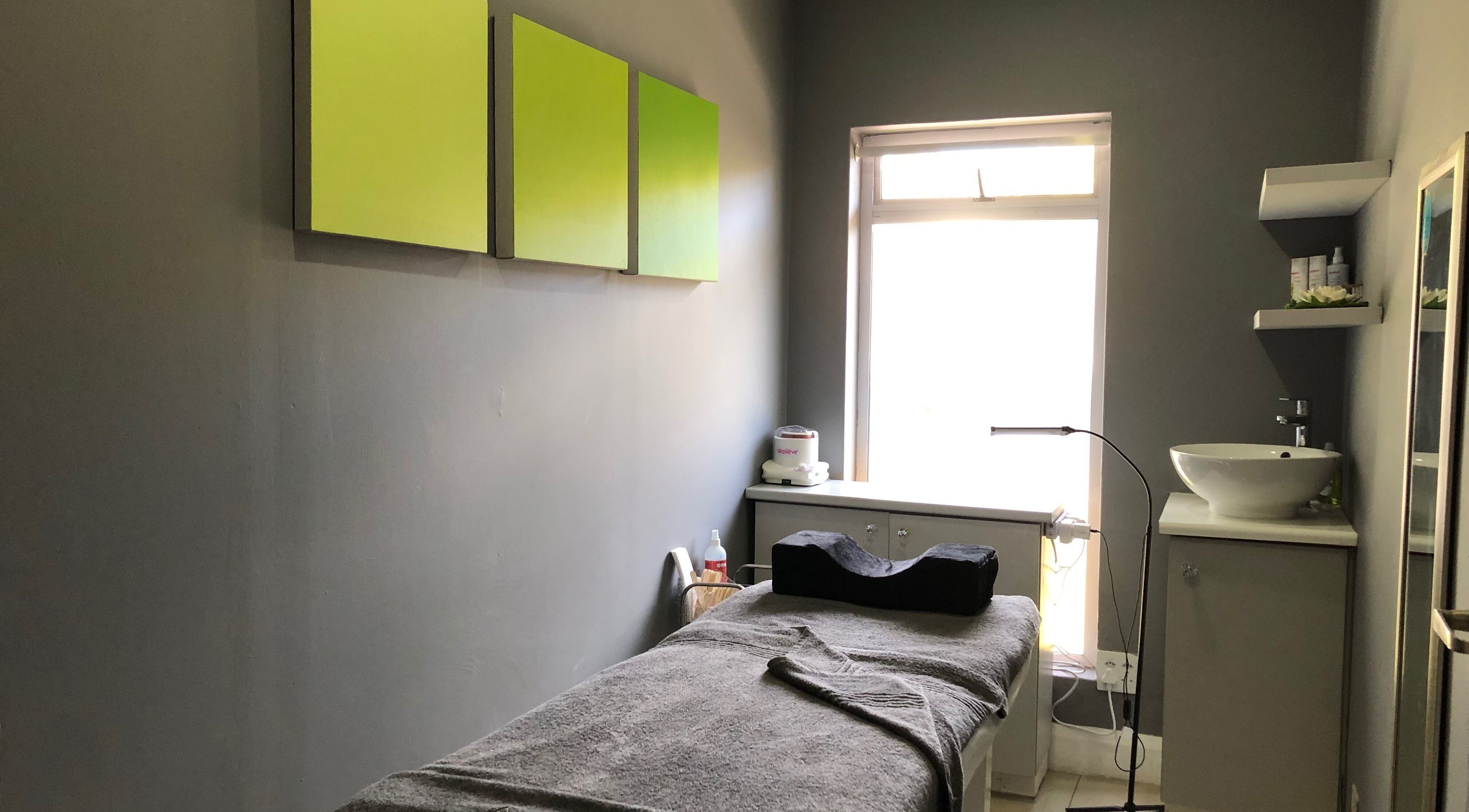 Relaxing treatment room at Brow Baby, Gqeberha, Eastern Cape, ZA, featuring soft lighting and cozy bed.