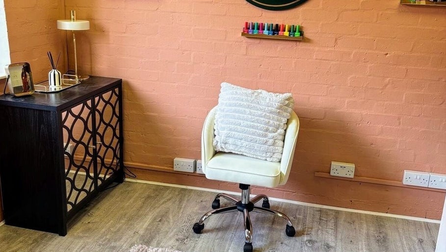 Cozy salon corner at NailedItByLarna with a plush chair and decor in Redditch, England, GB.
