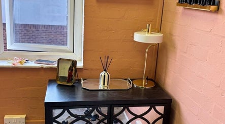 Chic vanity setup at NailedItByLarna, Redditch, England, GB with modern decor and soft lighting.