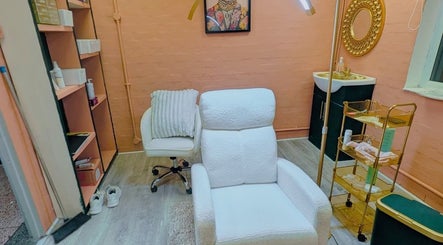 Inviting treatment room at BROWSByLarna in Redditch, England, GB with plush chairs and elegant decor.