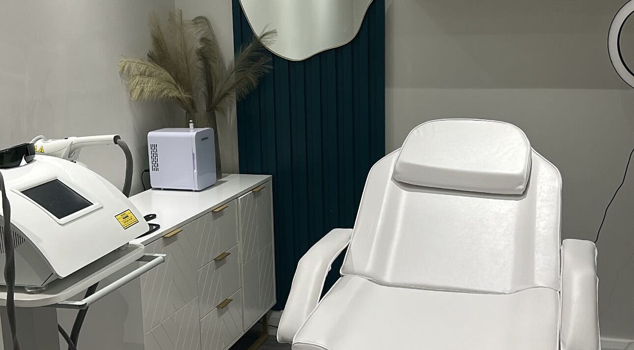 Modern treatment room at The Clinic by Jessica May, Lowton, England, GB featuring a white reclining chair.