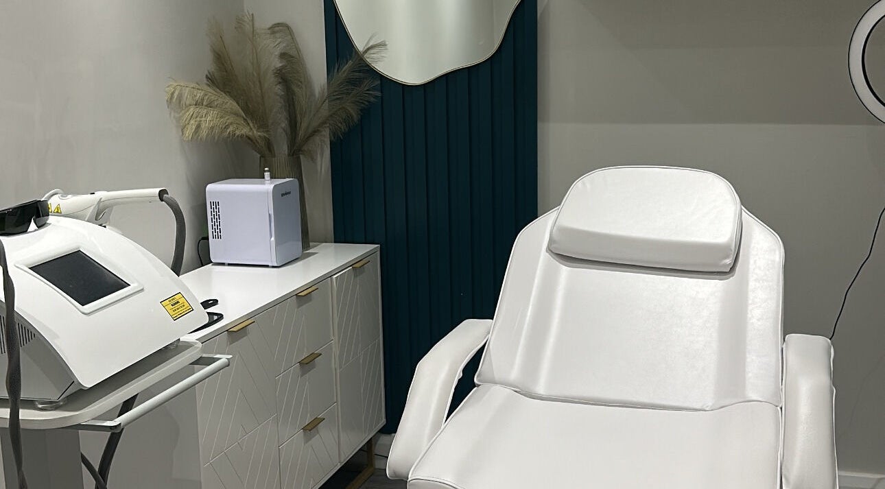 Modern treatment room at The Clinic by Jessica May, Lowton, England, GB featuring a white reclining chair.