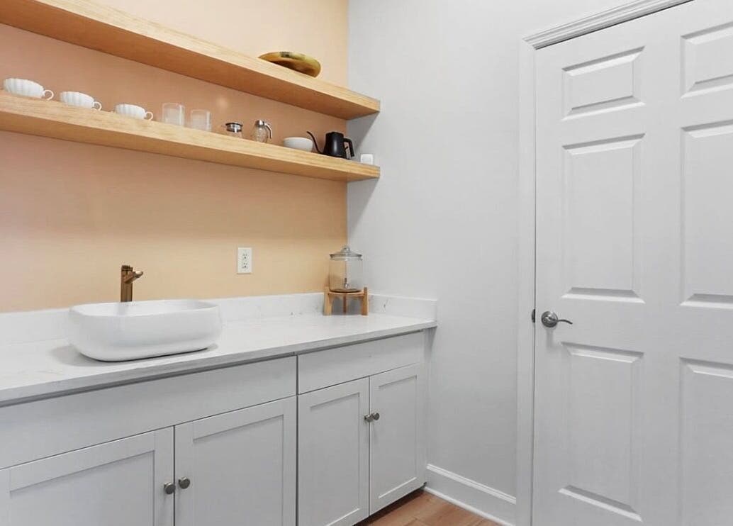 Elegant wash area with shelving at LOR Beauty Concept in Jacksonville, Florida, US.