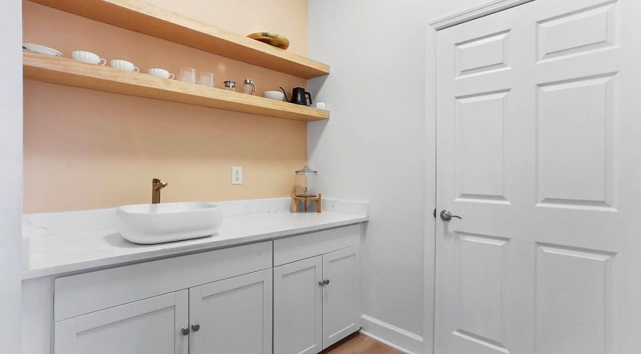 Elegant wash area with shelving at LOR Beauty Concept in Jacksonville, Florida, US.