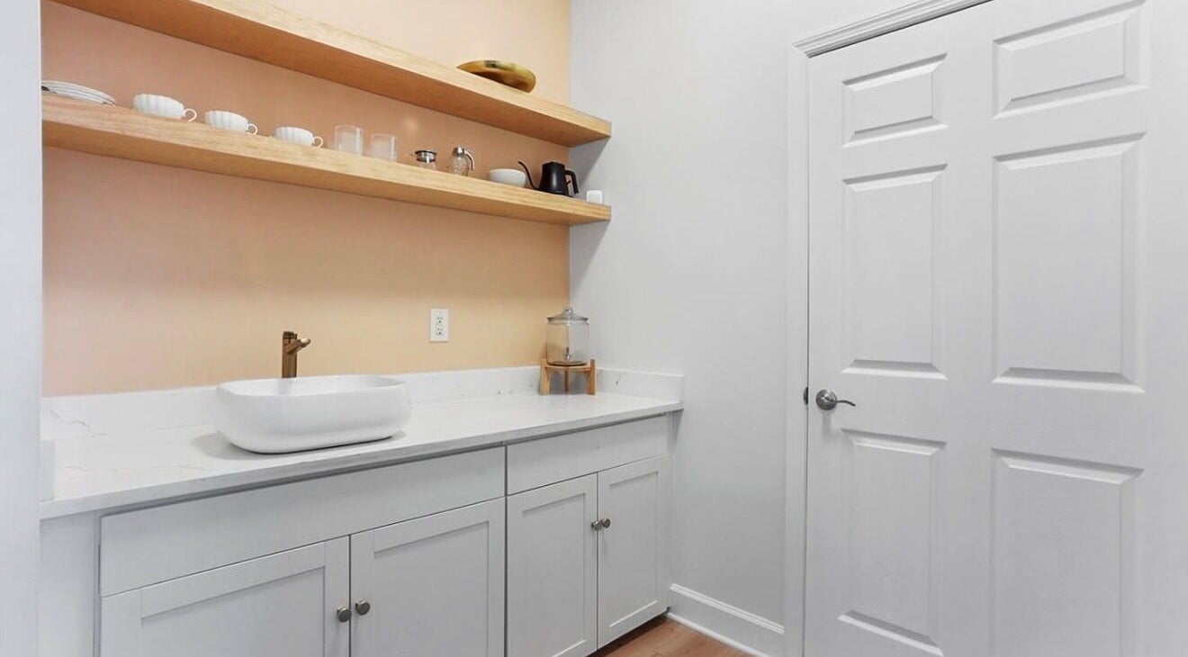 Elegant wash area with shelving at LOR Beauty Concept in Jacksonville, Florida, US.