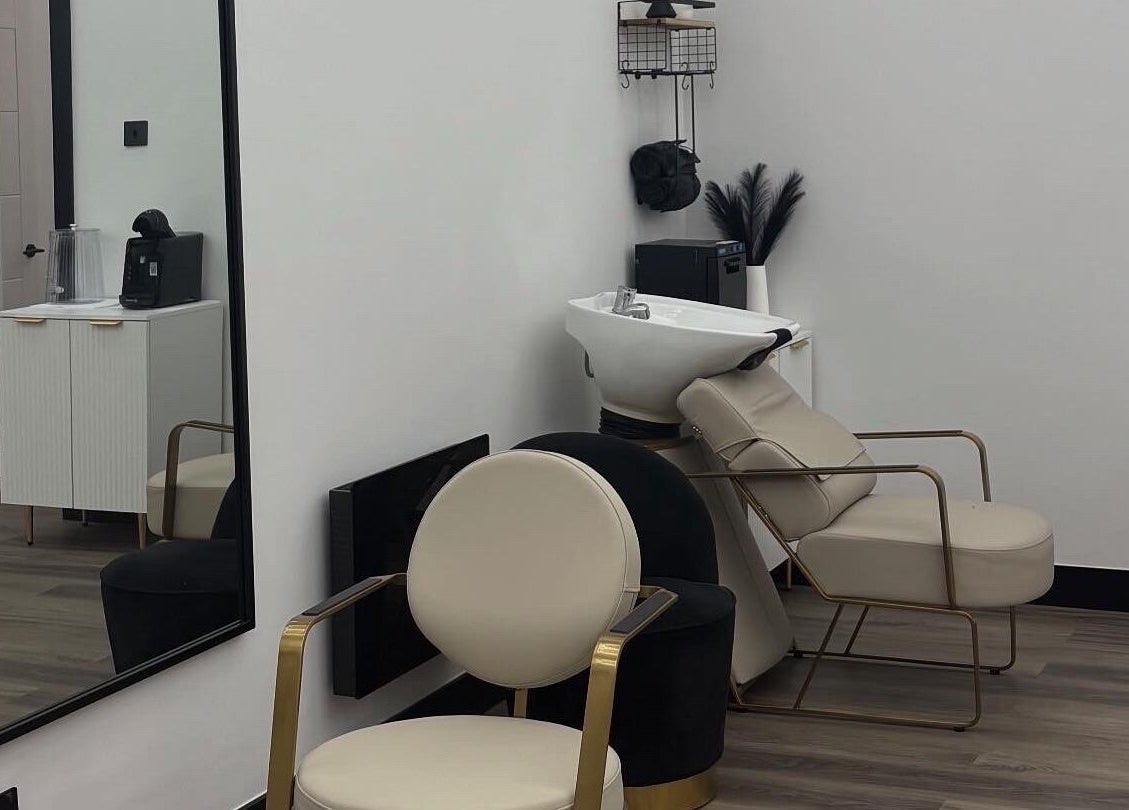 Elegant salon chairs and wash basin at Maya The Hairstylist, Redditch, England, GB.