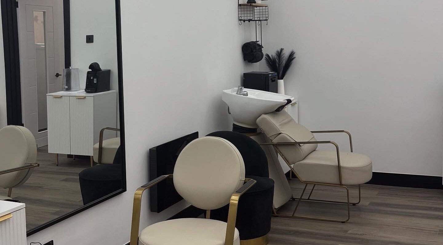 Elegant salon chairs and wash basin at Maya The Hairstylist, Redditch, England, GB.