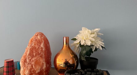 Elegant decor at Harmonie Oasis, Waldshut-tiengen, Baden-Württemberg, DE, featuring a salt lamp and flowers.