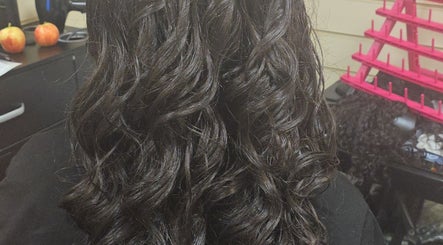 Lustrous curly hair styled at Arty salon, Rochdale, England, GB.
