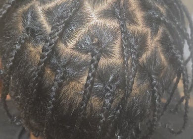 Intricate braided hairstyle at Arty, Rochdale, England, GB showcasing expert styling skills.
