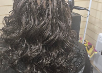 Stylishly curled hair at Arty salon, Rochdale, England, GB, showcasing expert styling techniques.